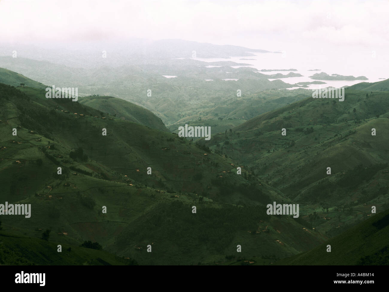 misty Lake Kivu green valley hillside landscape Rwanda Stock Photo