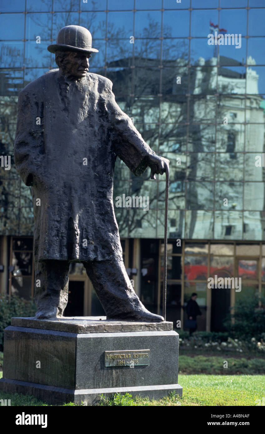 Belgrade, Serbia, Yugoslavia. Sculpture of Branislav Nusic with a walking stick and bowler hat by Zoran Ivanovic; Trg Republike. Stock Photo