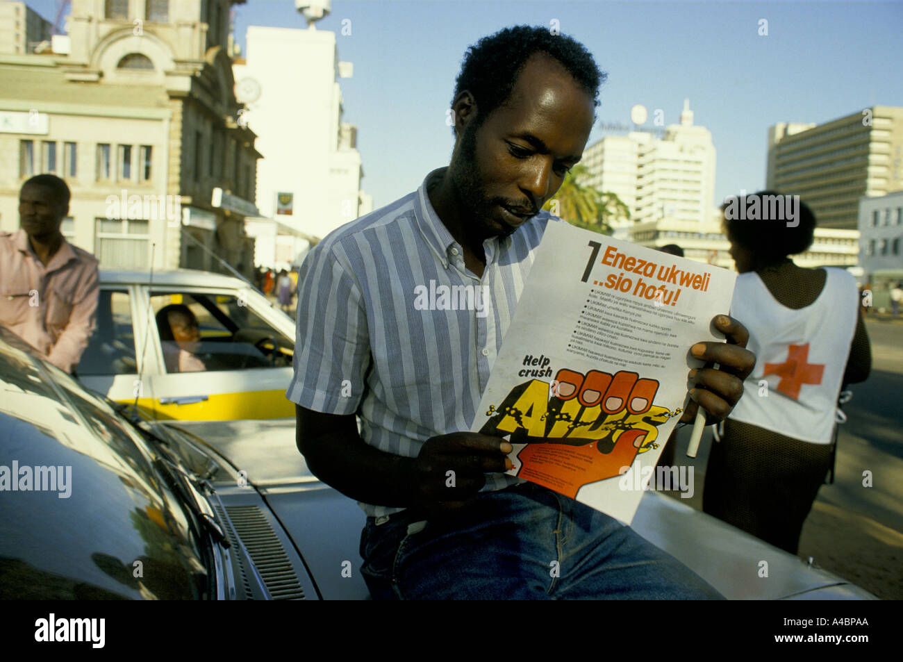 aids in uganda man reading help crush aids leaflet Stock Photo Alamy