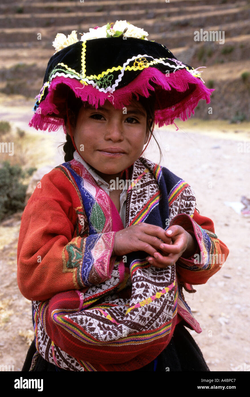 Pisac, Peru. Young Quechua girl wearing traditional dress Stock Photo
