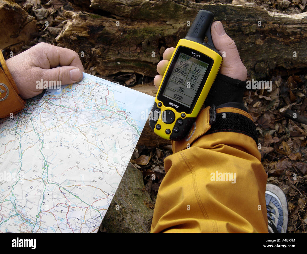 Generic shot of a walker using a GPS handheld navigation system on a