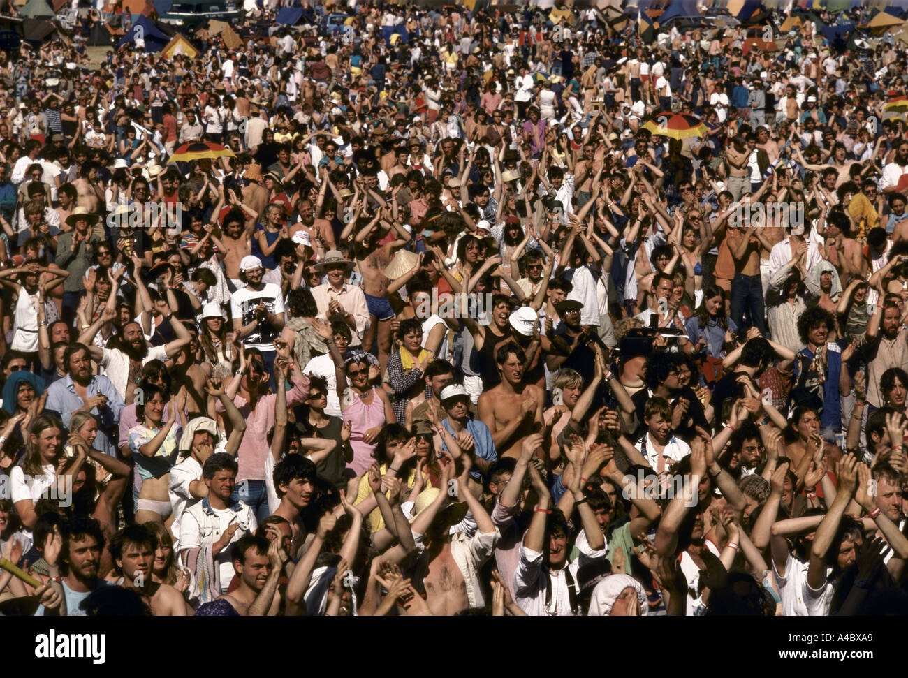 Crowds watch poerformers on the main stage, Glastonbury Festival, 1982 Stock Photo