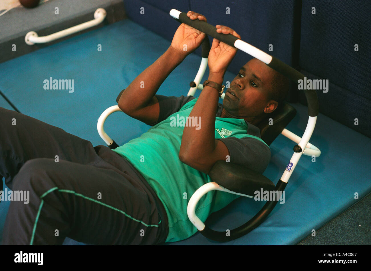 Man doing situps with a frame Stock Photo