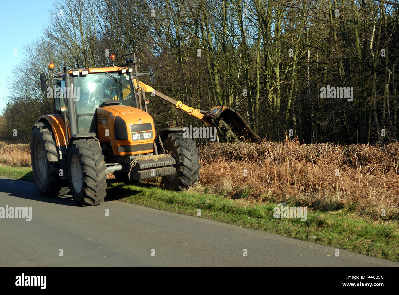 Hedge cutting tractor. Stock Photo