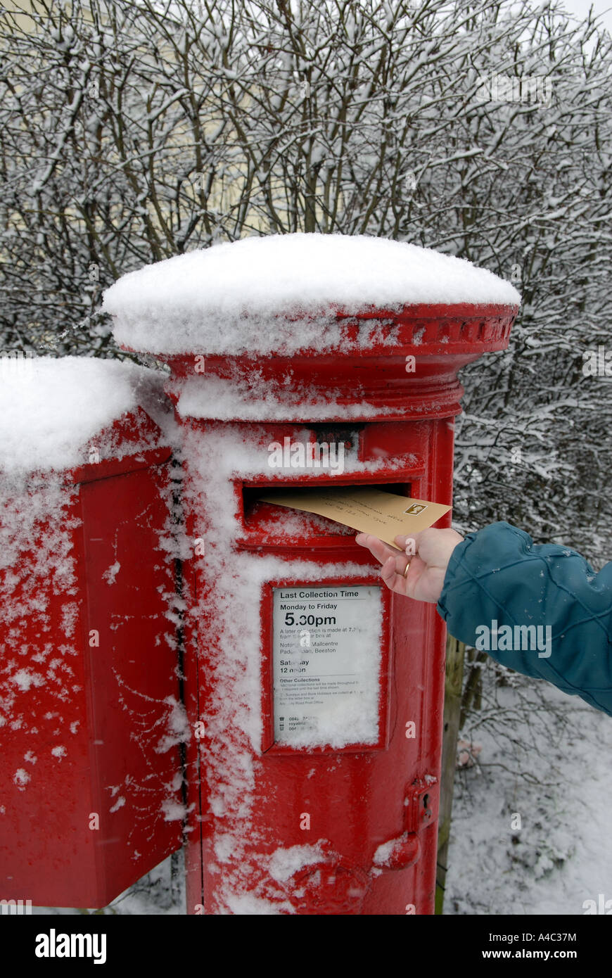 Posting Letter in Snow Storm Stock Photo Alamy