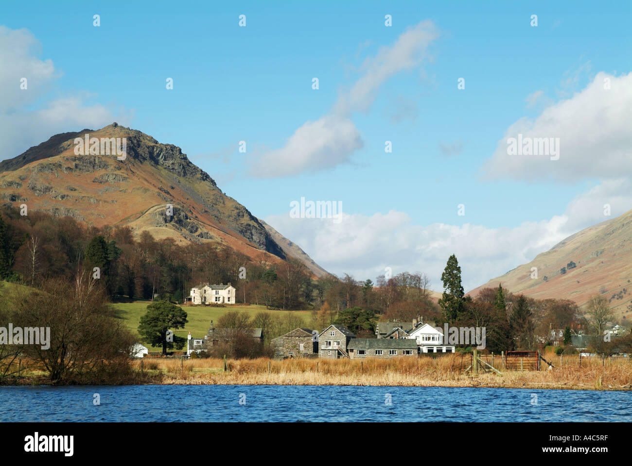 Helm Crag and the western end of Grasmere village from the surface of Grasmere, Lake District, Cumbria, England, UK. Stock Photo