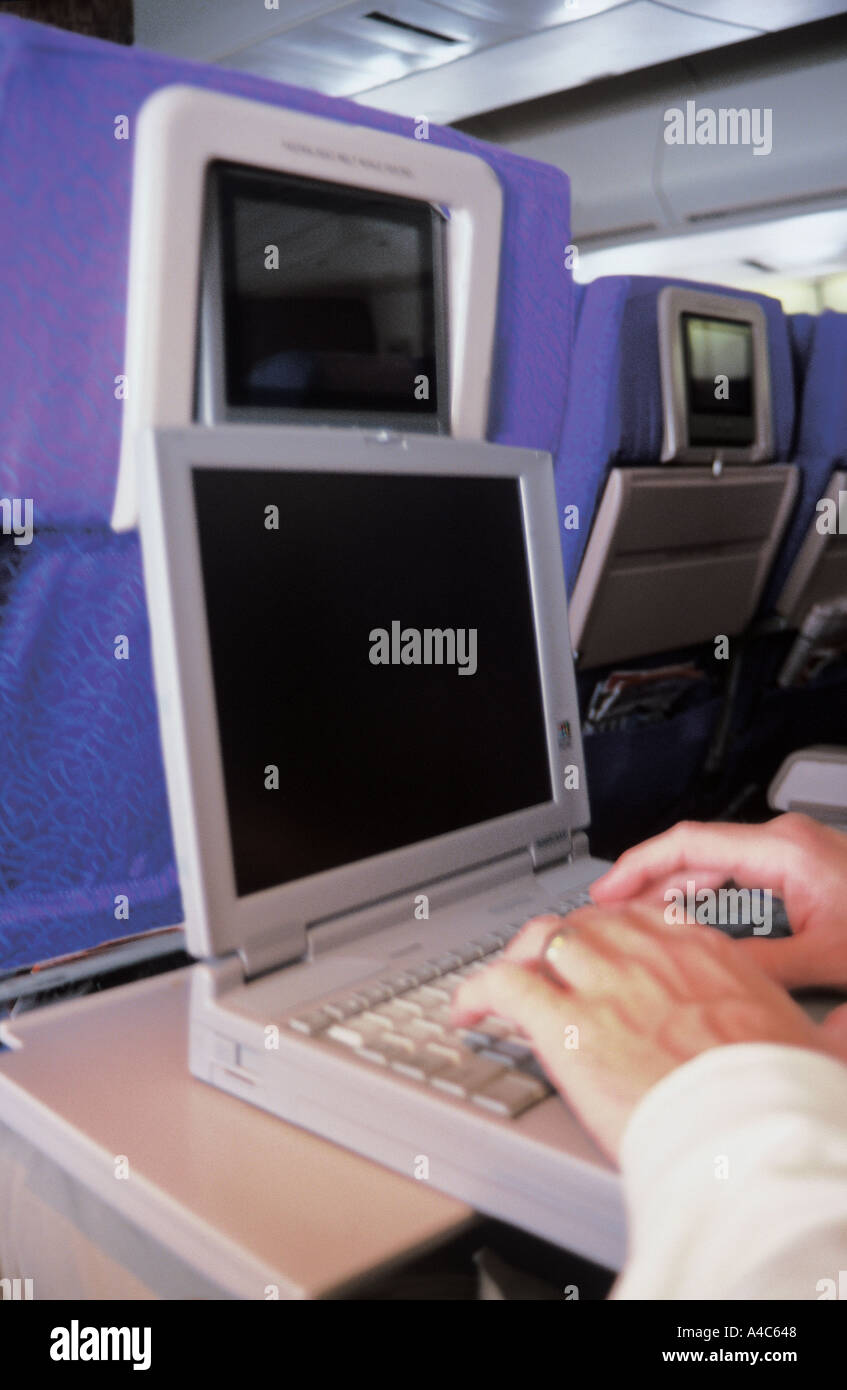 Using laptop inflight Stock Photo Alamy