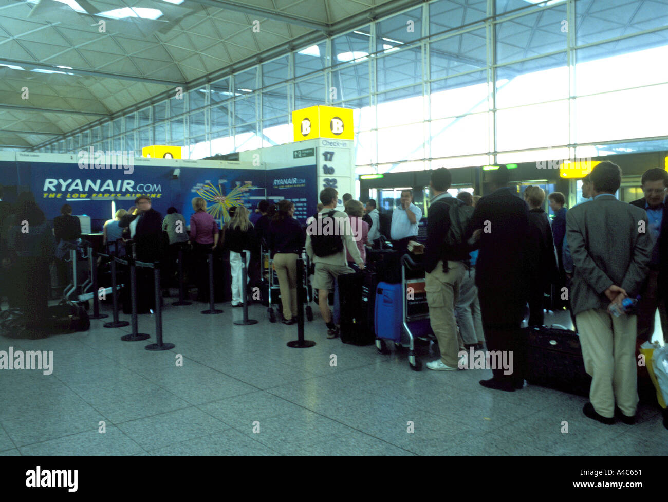 Long Check in queue Ryanair Stansted Airport UK Stock Photo Alamy