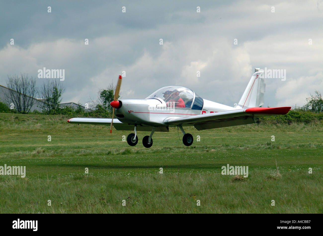 Microlight Aerotechnik EV 97 Eurostar landing at Popham airfield Stock