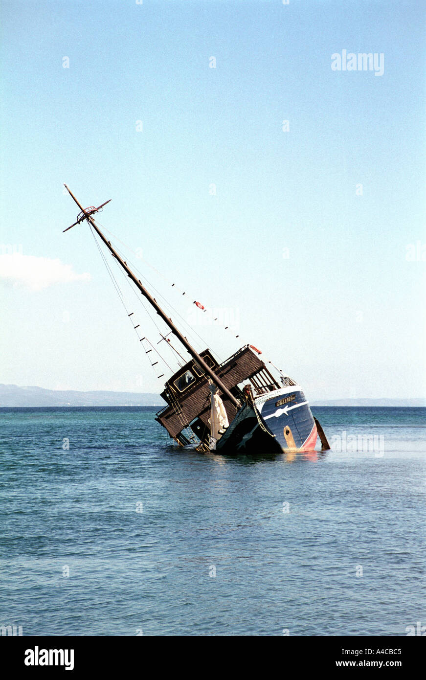 Half sunken ship in shallow seashore, Xalkidiki Greece Stock Photo