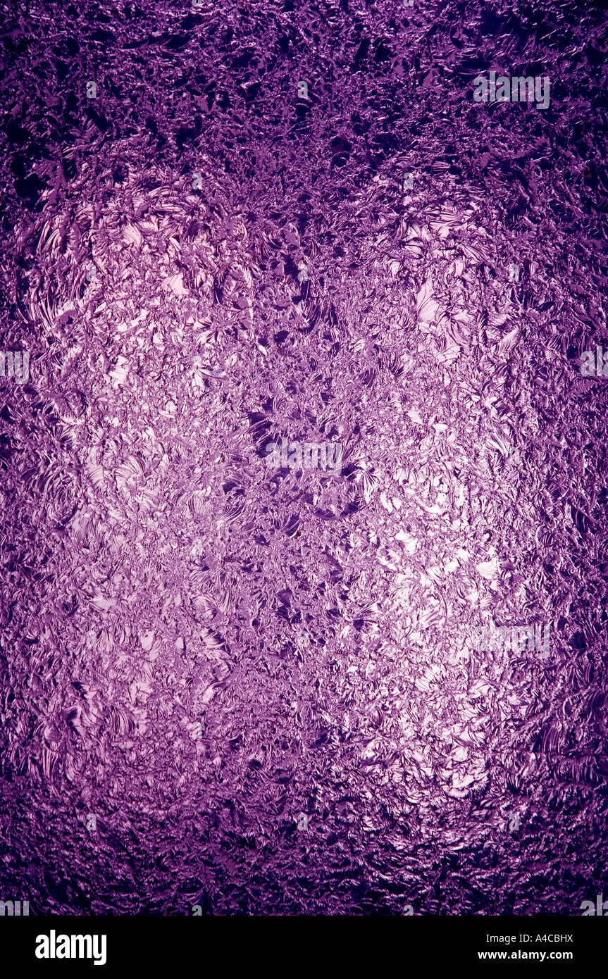 A backlit pane of beautifully textured deep purple stained glass. Space