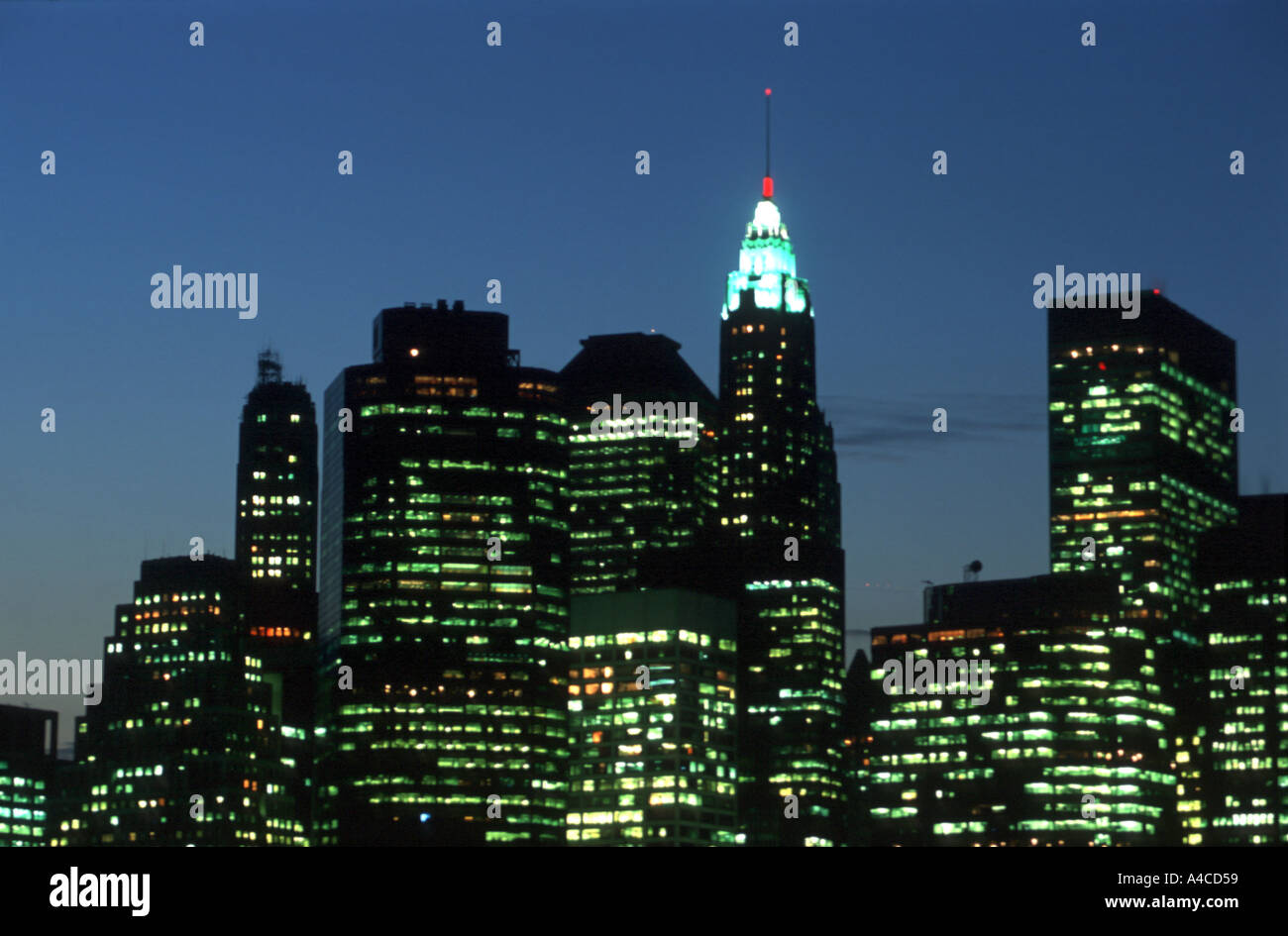 Illuminated lower Manhattan skyline at dusk, Brooklyn New York City USA ...