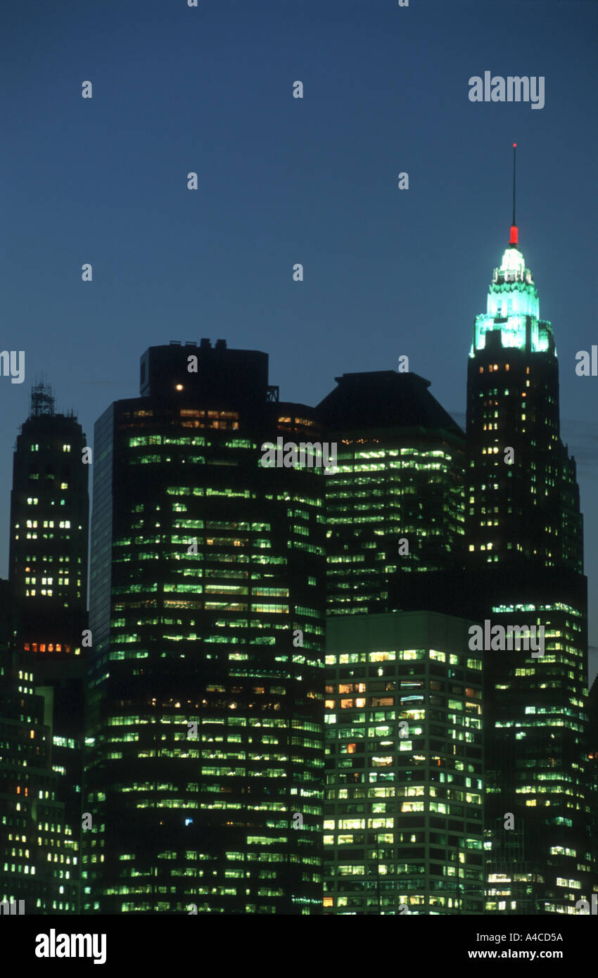 Illuminated lower Manhattan skyline at dusk, Brooklyn New York City USA ...