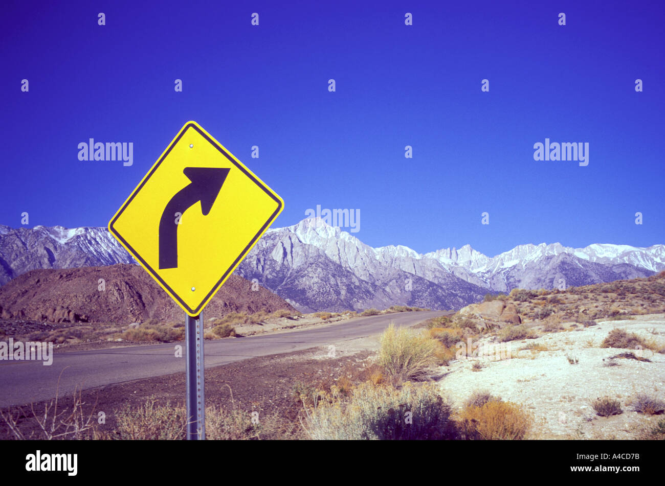 Roadway sign indicating a right turn Lone Pine California USA Stock
