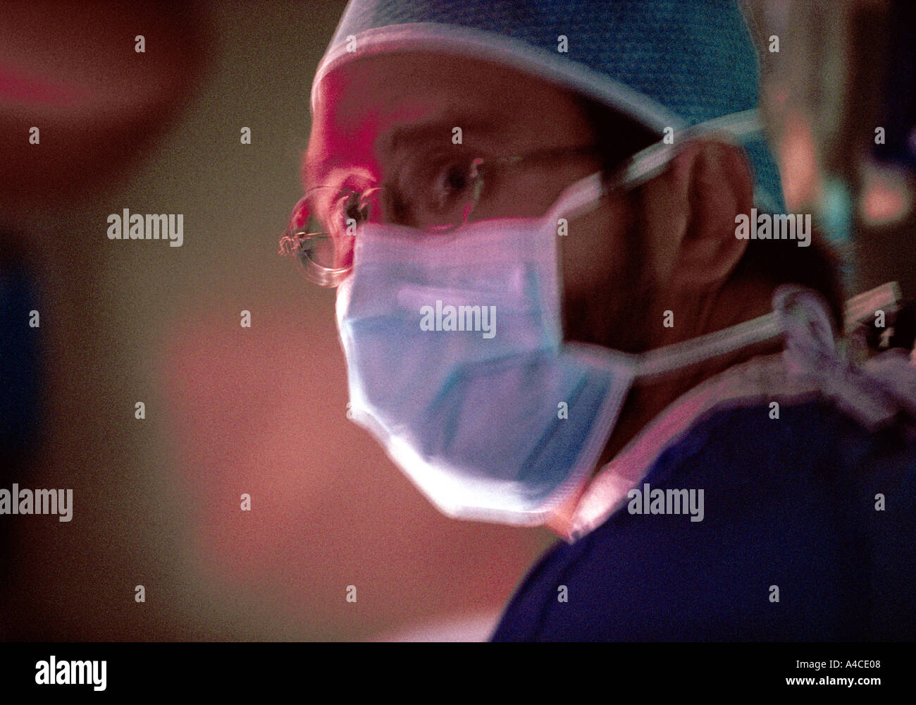 A doctor looks stressed during surgery Stock Photo