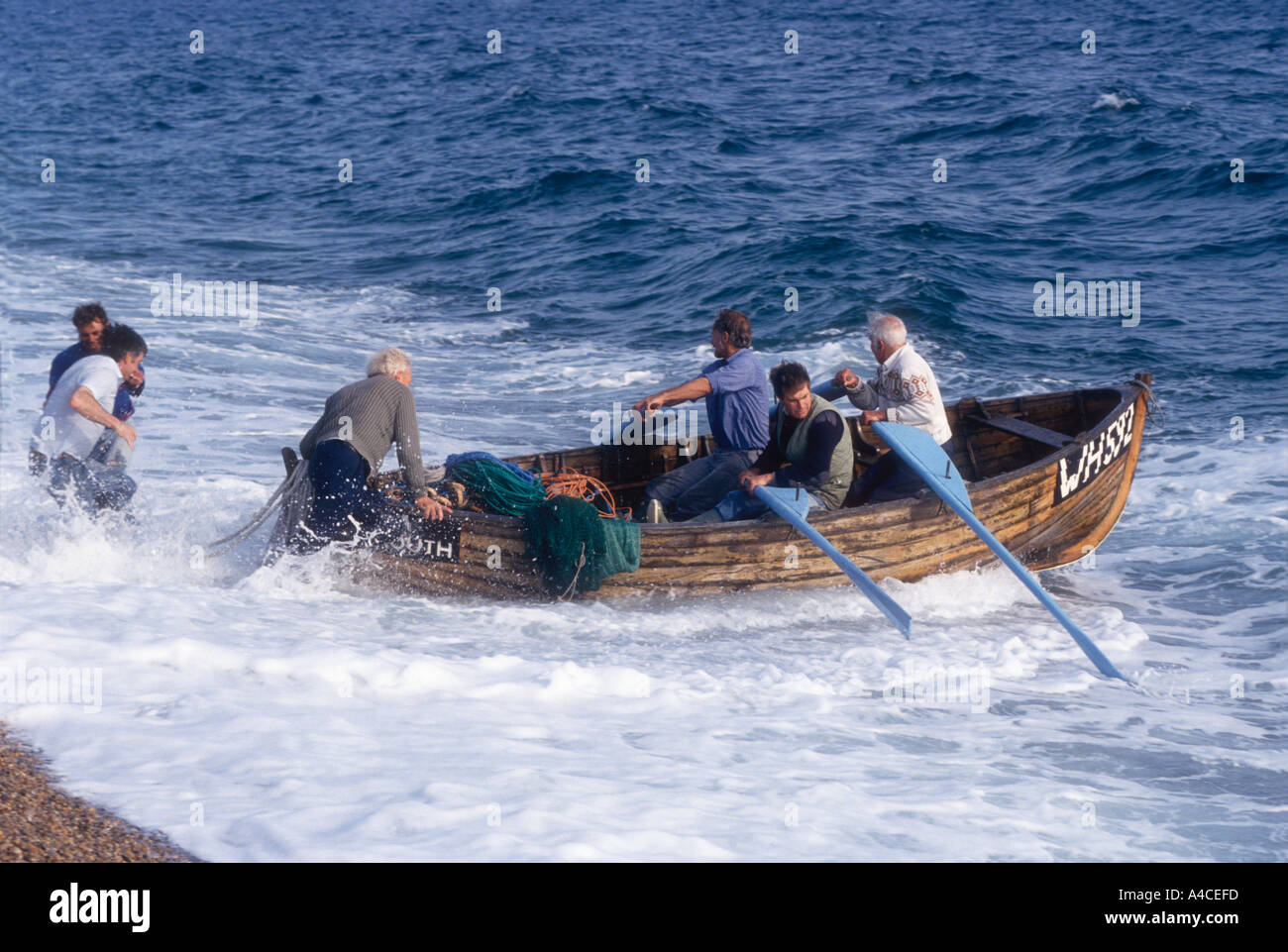 Traditional seine net fishing for mackerel in lerret boat off