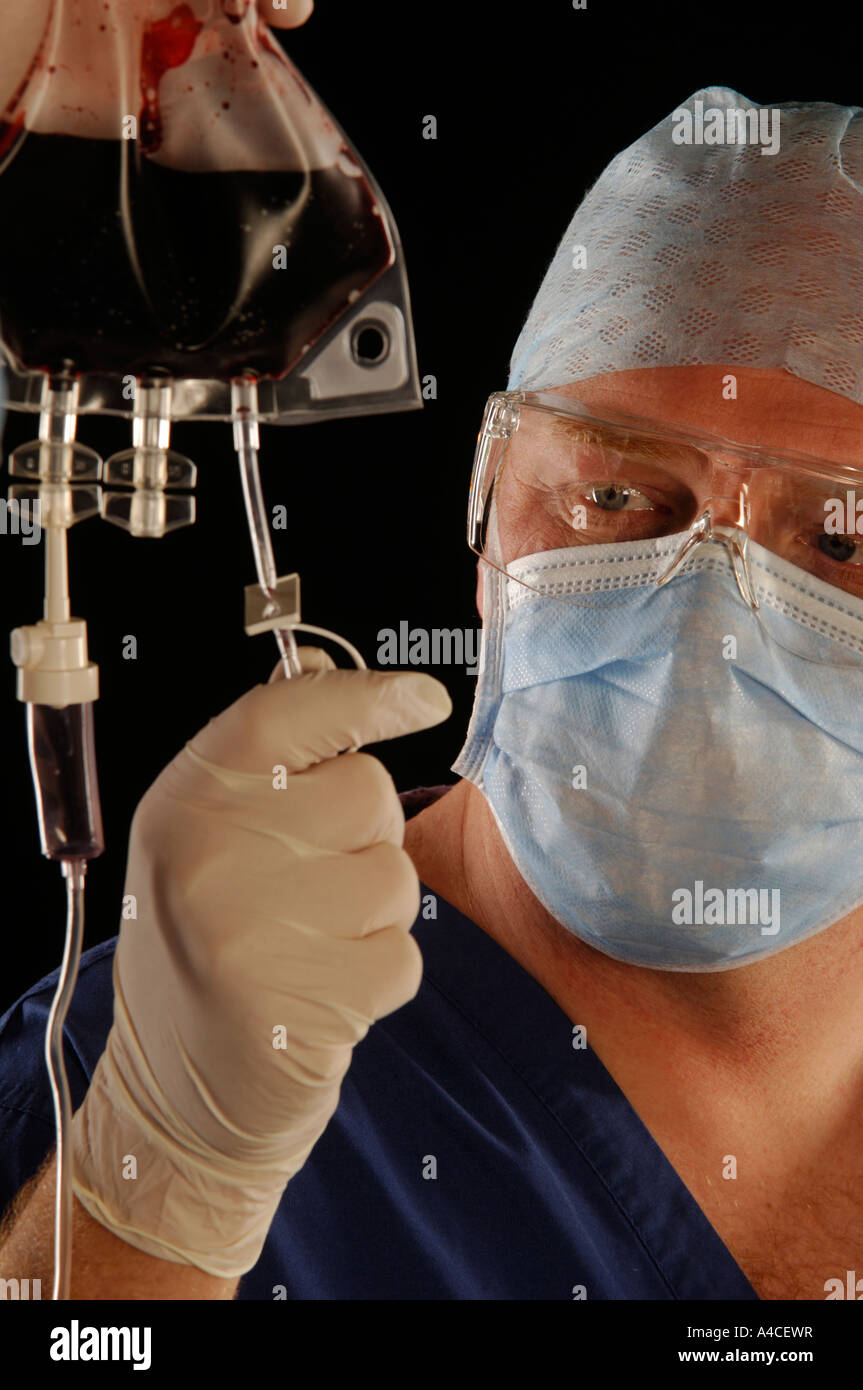 Surgeon checking line Stock Photo - Alamy
