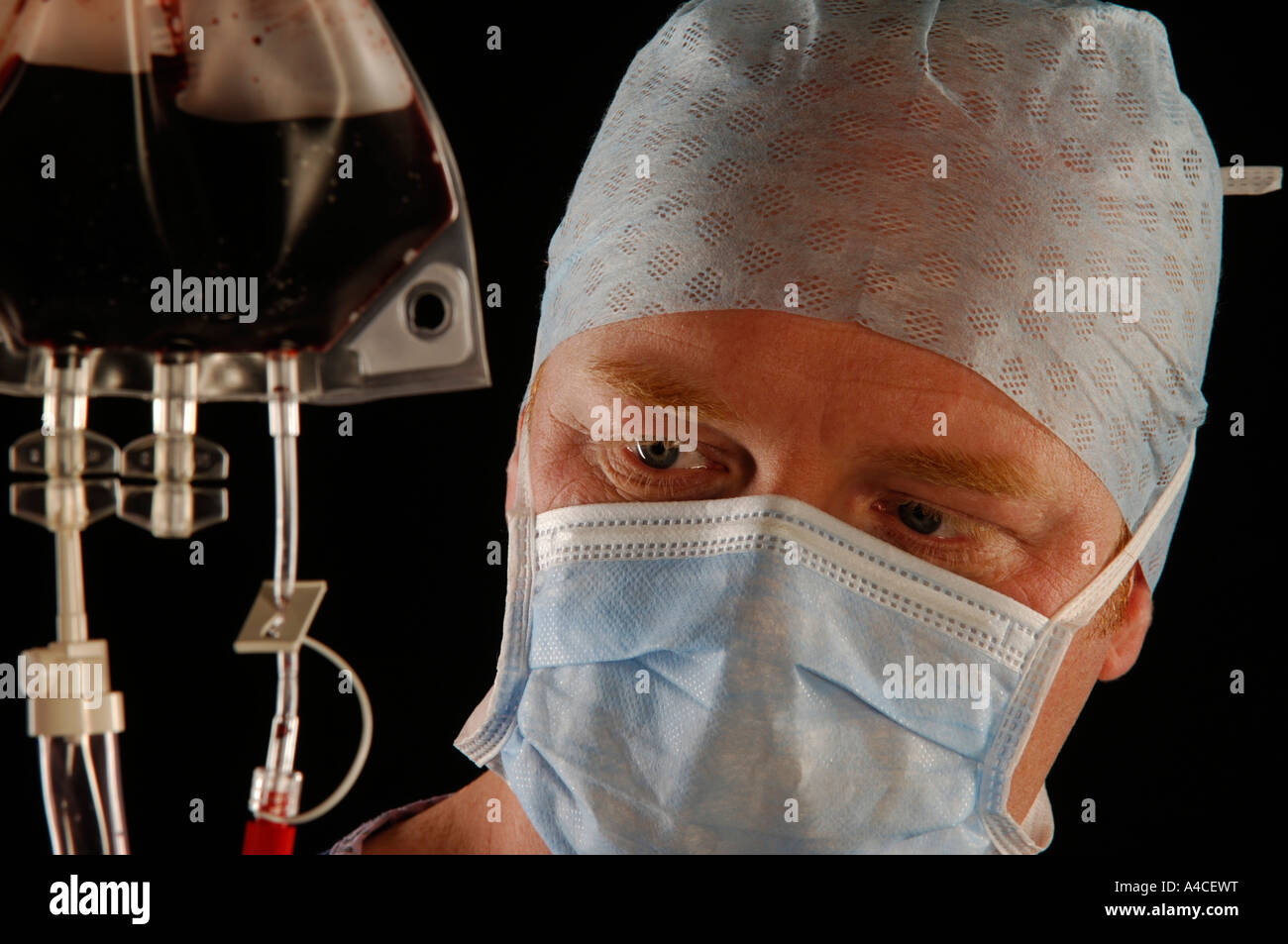 Surgeon checking line Stock Photo - Alamy