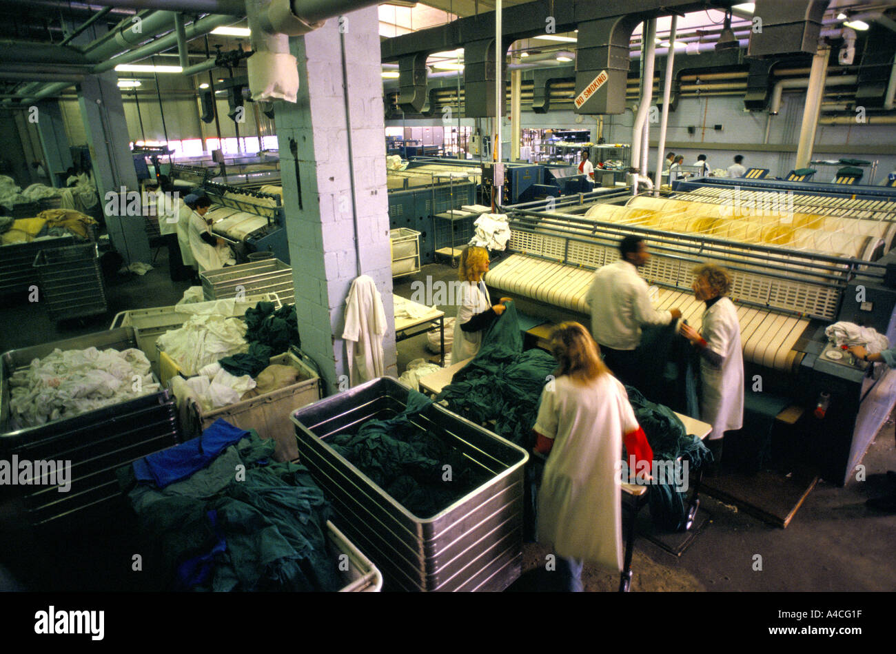 Laundry staff at work in the hospital laundry at Whipps Cross Hospital