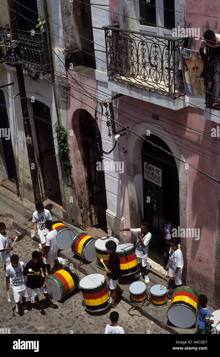 Salvador, Brazil. Olodum drum band with green, red, yellow and black drums preparing to play in colonial Pelourinho. Stock Photo