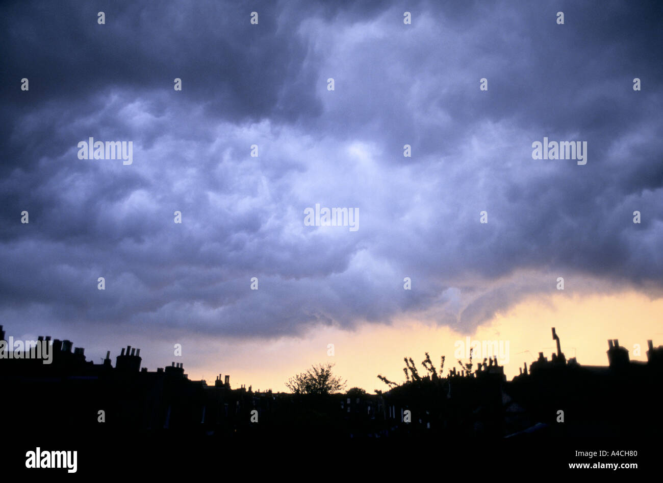 STORM CLOUDS OVER ROOFTOPS, HACKNEY, LONDON Stock Photo