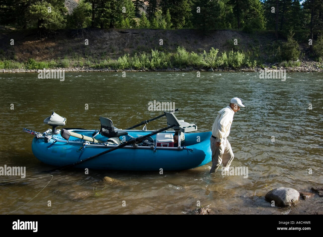 A Montana fly fishing guide with his raft on the Blackfoot River