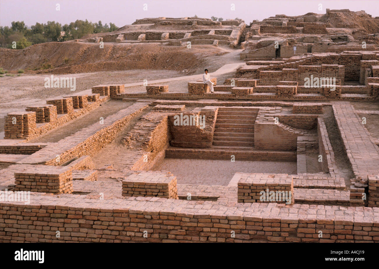 Imran Khan, cricketer, sits in the ruins of the great bath at the ancient city of Mohenjodaro, Pakistan,  1990. Stock Photo