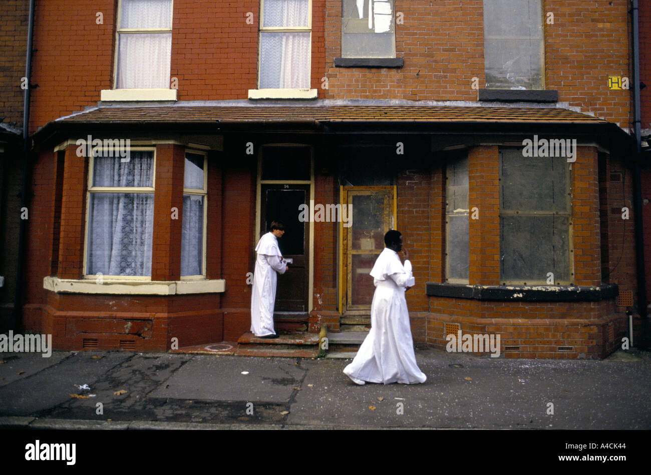 MEMBERS OF THE 'CHURCH OF THE CROSS AND STAR' AN EVANGELICAL CHRISTIAN SECT, WALK THROUGH MOSS SIDE, MANCHESTER, ENGLAND, 1993 Stock Photo