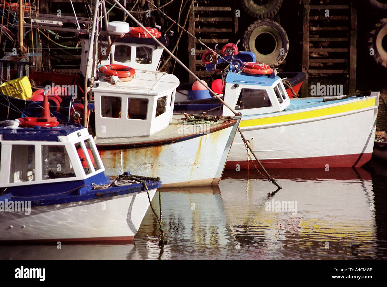 Fishing boats in harbour Stock Photo - Alamy