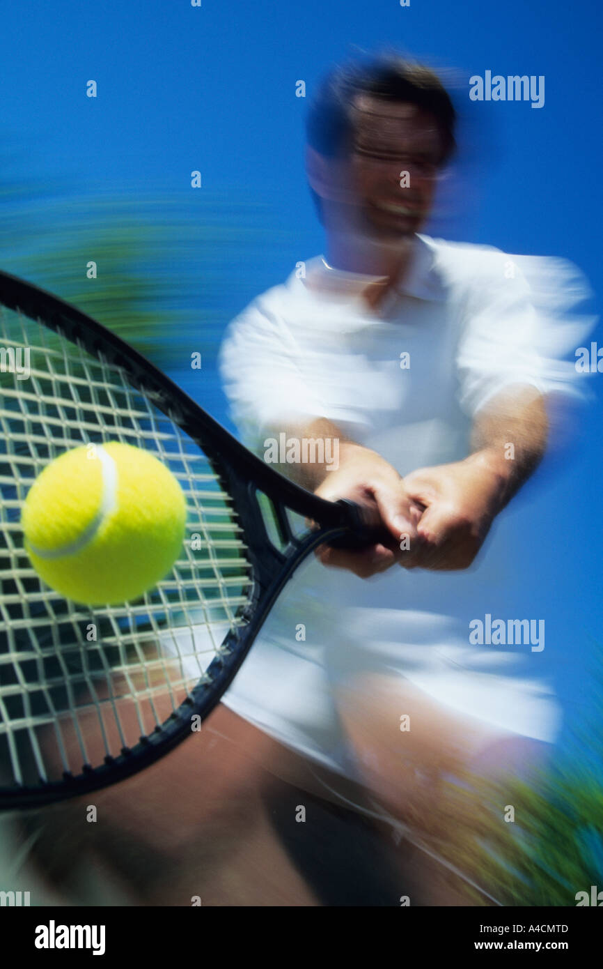 Tennis player returning ball Stock Photo Alamy