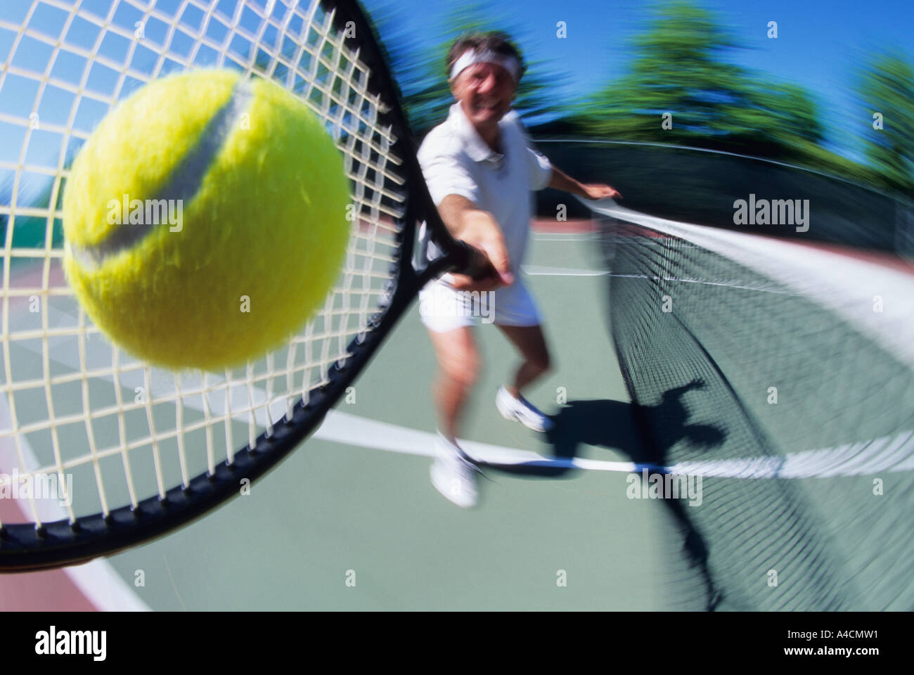 Tennis player returning ball Stock Photo Alamy