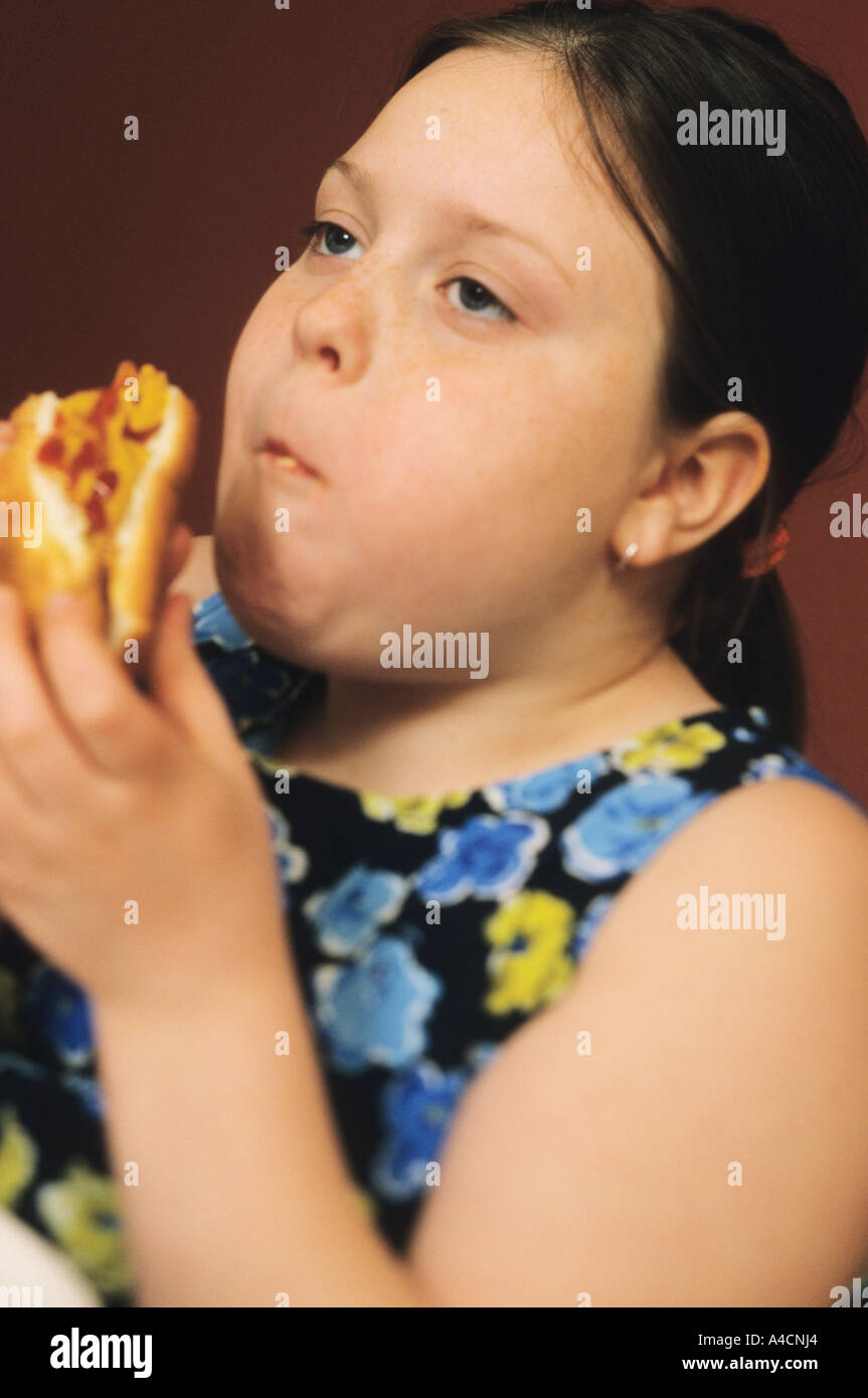 11 year old eating a hotdog Stock Photo