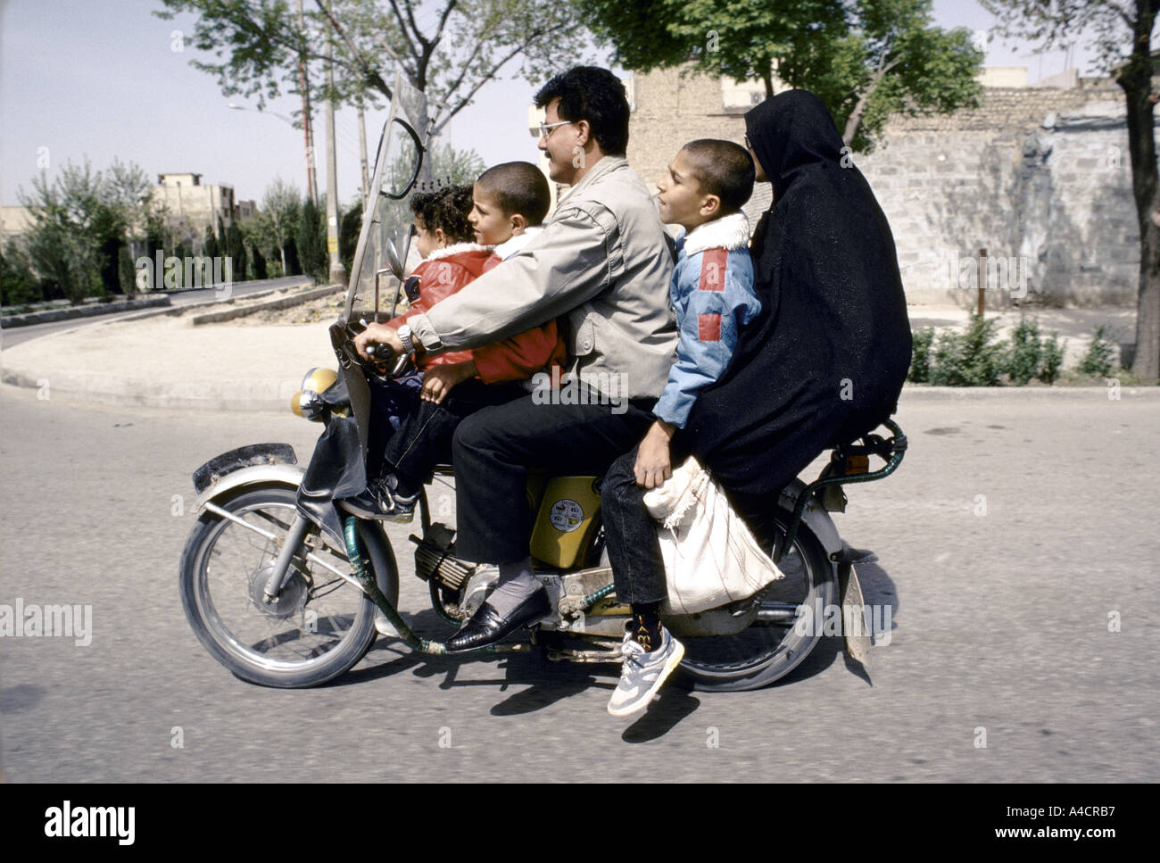 Family of five riding on motorbike in Tehran, Iran, during Friday, a