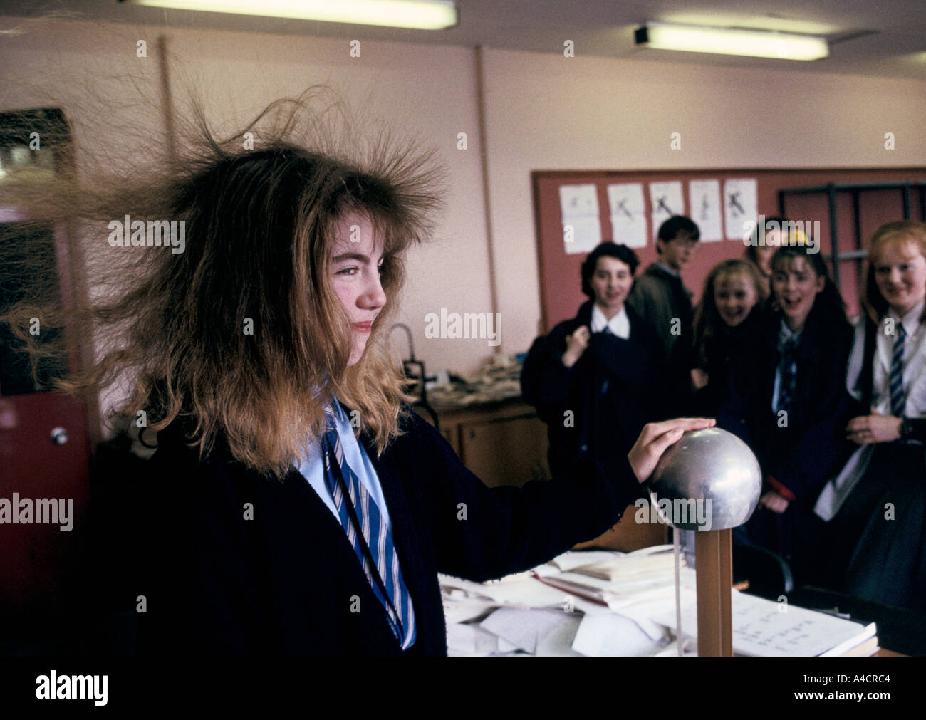 A TEENAGE PUPIL HAVING A HAIR RAISING EXPERIENCE BY TOUCHING THE VAN