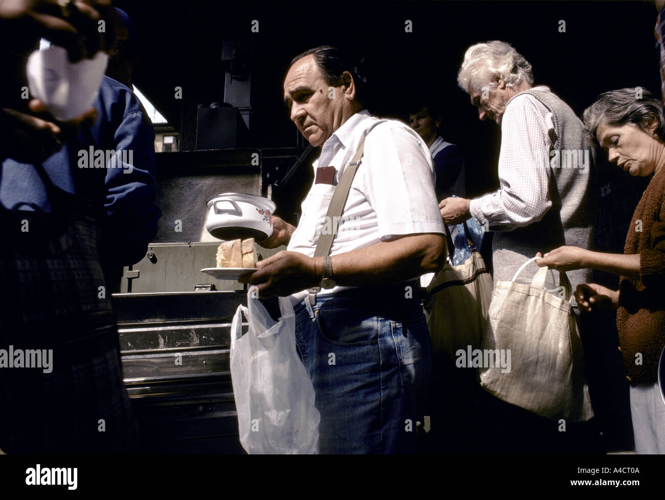 People queue for food supplies from Red Cross in Grbavica, Serb-controlled  Saravejo Stock Photo