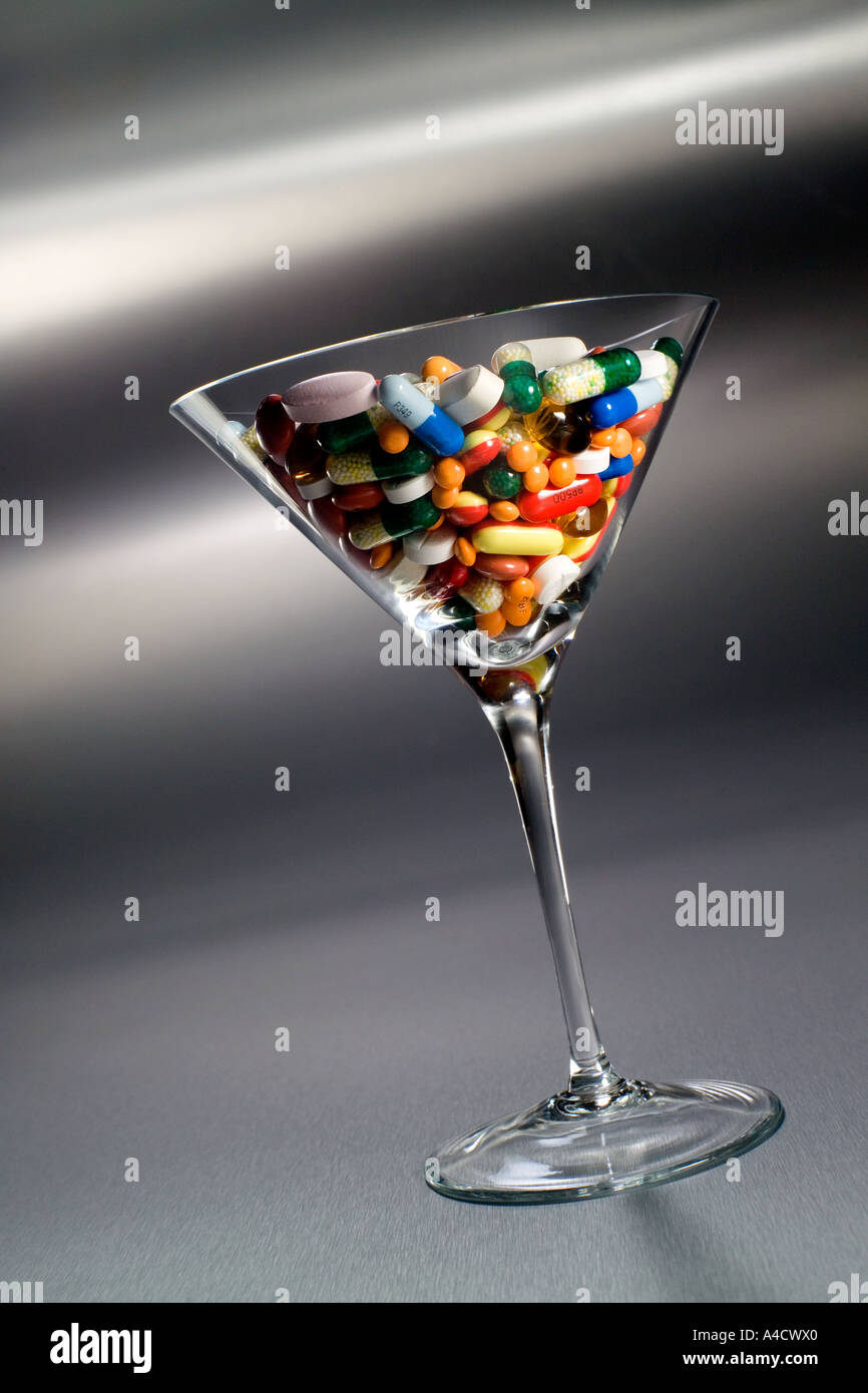 Martini glass of pills Stock Photo - Alamy