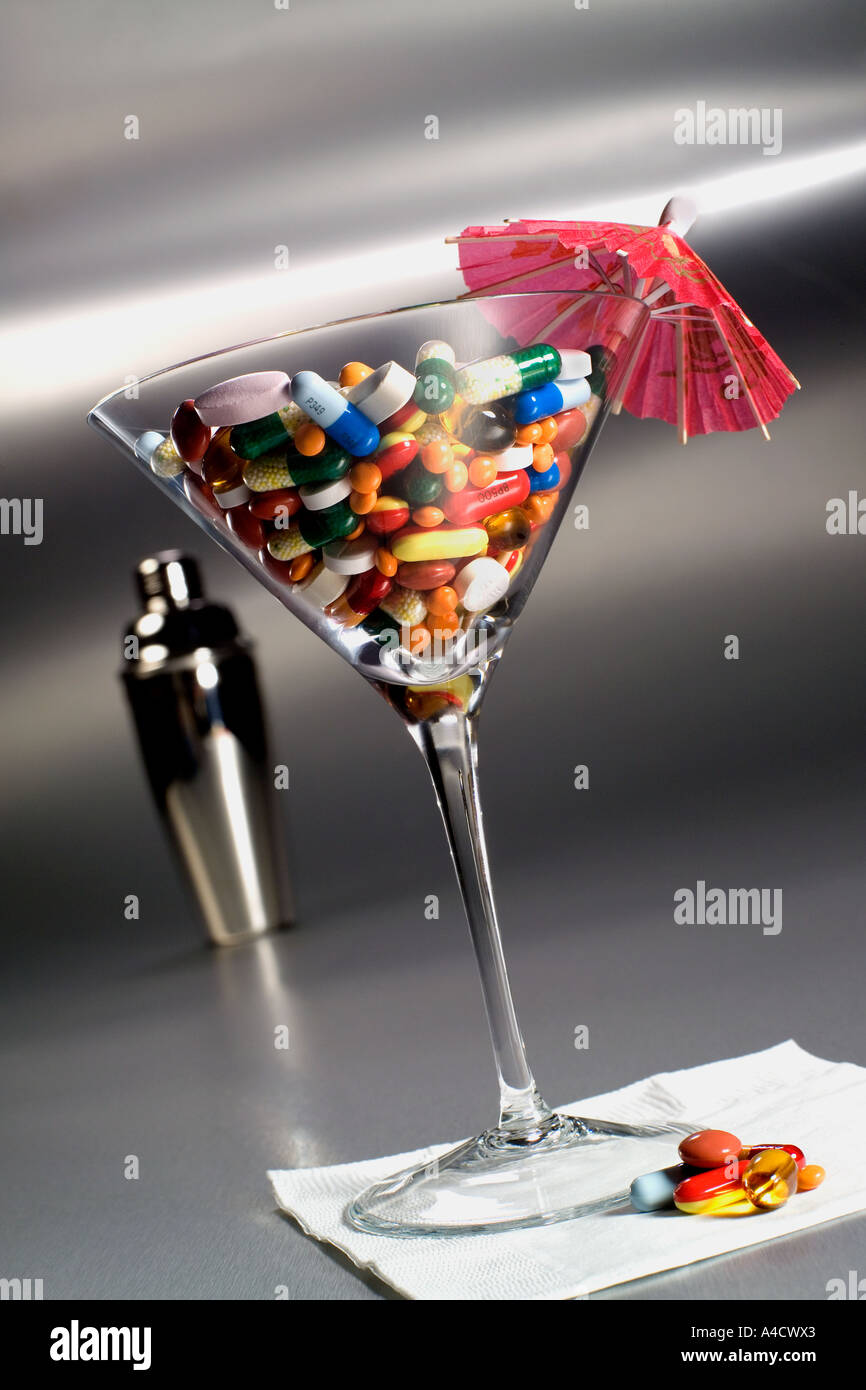 Martini glass of pills Stock Photo - Alamy