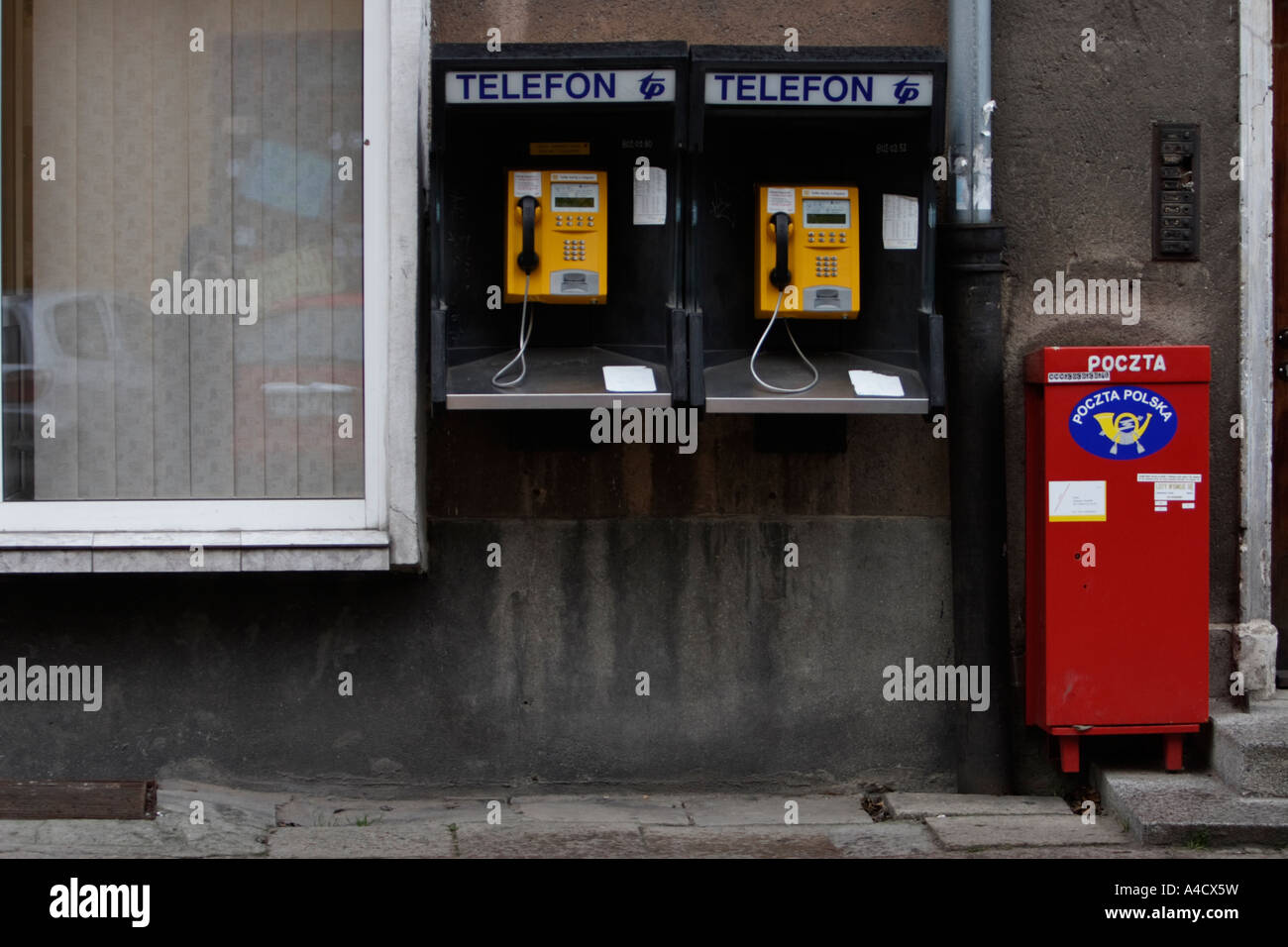 POLAND, GDANSK, 25.12.2006. Polish outdoor telephones and mailbox Stock Photo