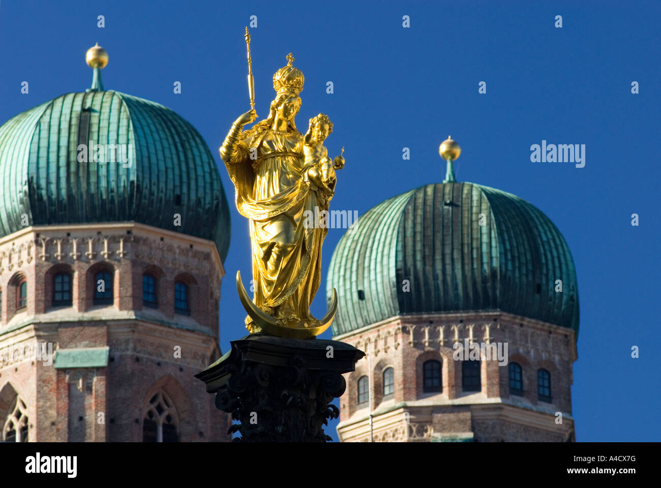 Statue of Maria on Marienplatz and towers of Frauenkirche Munich Upper ...