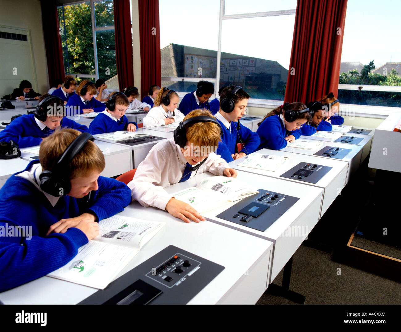 Education class of uniformed schoolchildren in language laboratory