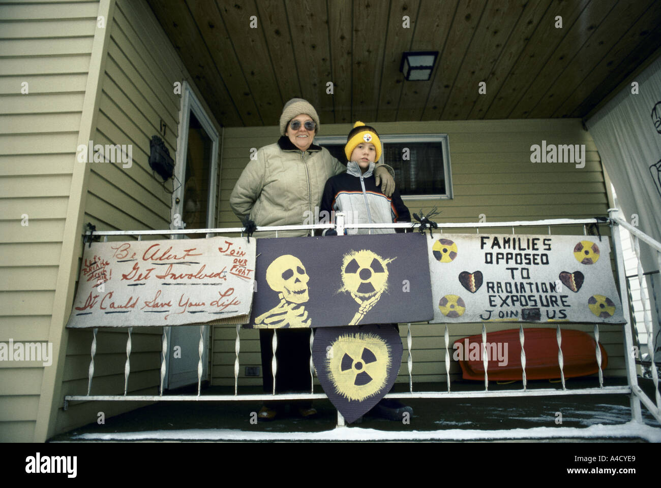Bella Spinosa with her grandson on the porch of her home displaying