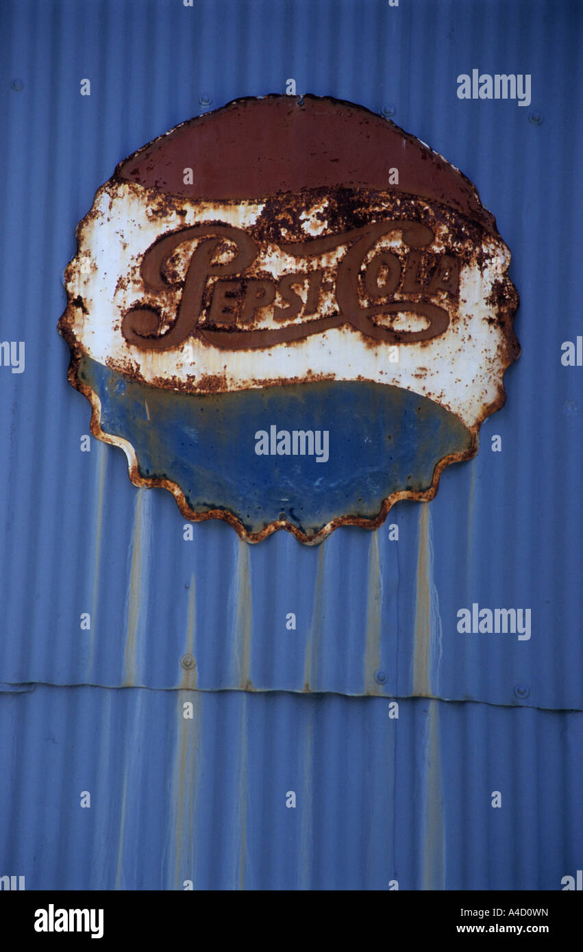 Sign, logo, old Pepsi advertising on wall, object, vintage signage, Pilgrims Rest, theme village, South Africa, rust, weathering, marketing, branding Stock Photo