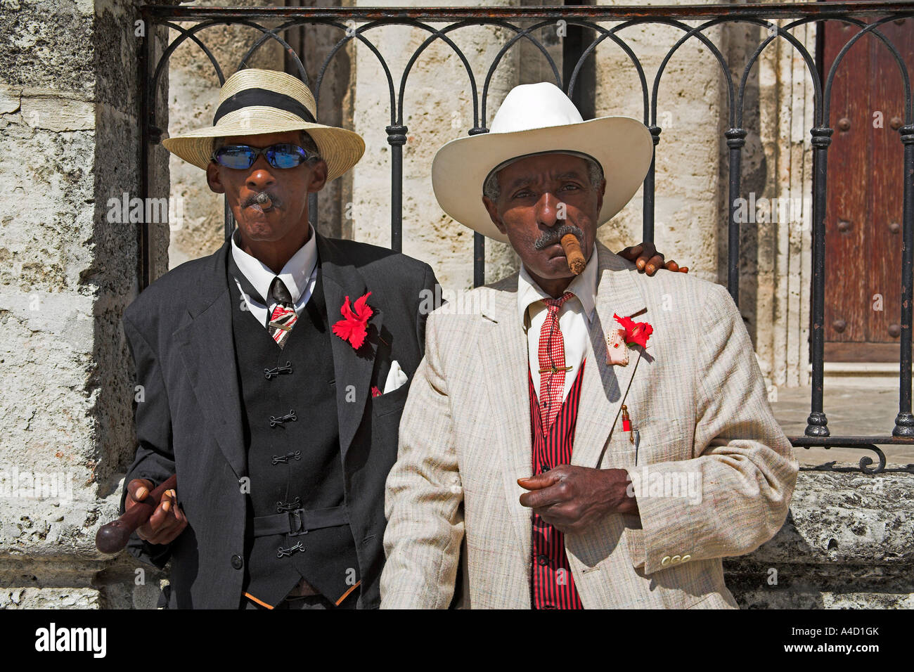 Two men smoking cigars, Plaza de la Catedral, Havana, La Habana Vieja, Cuba Stock Photo