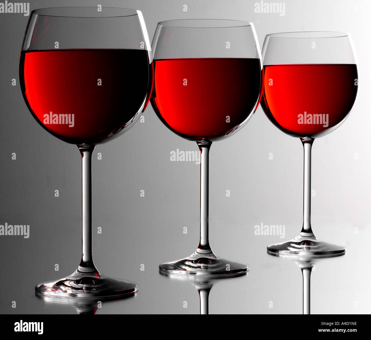 THREE RED WINE GLASSES Stock Photo