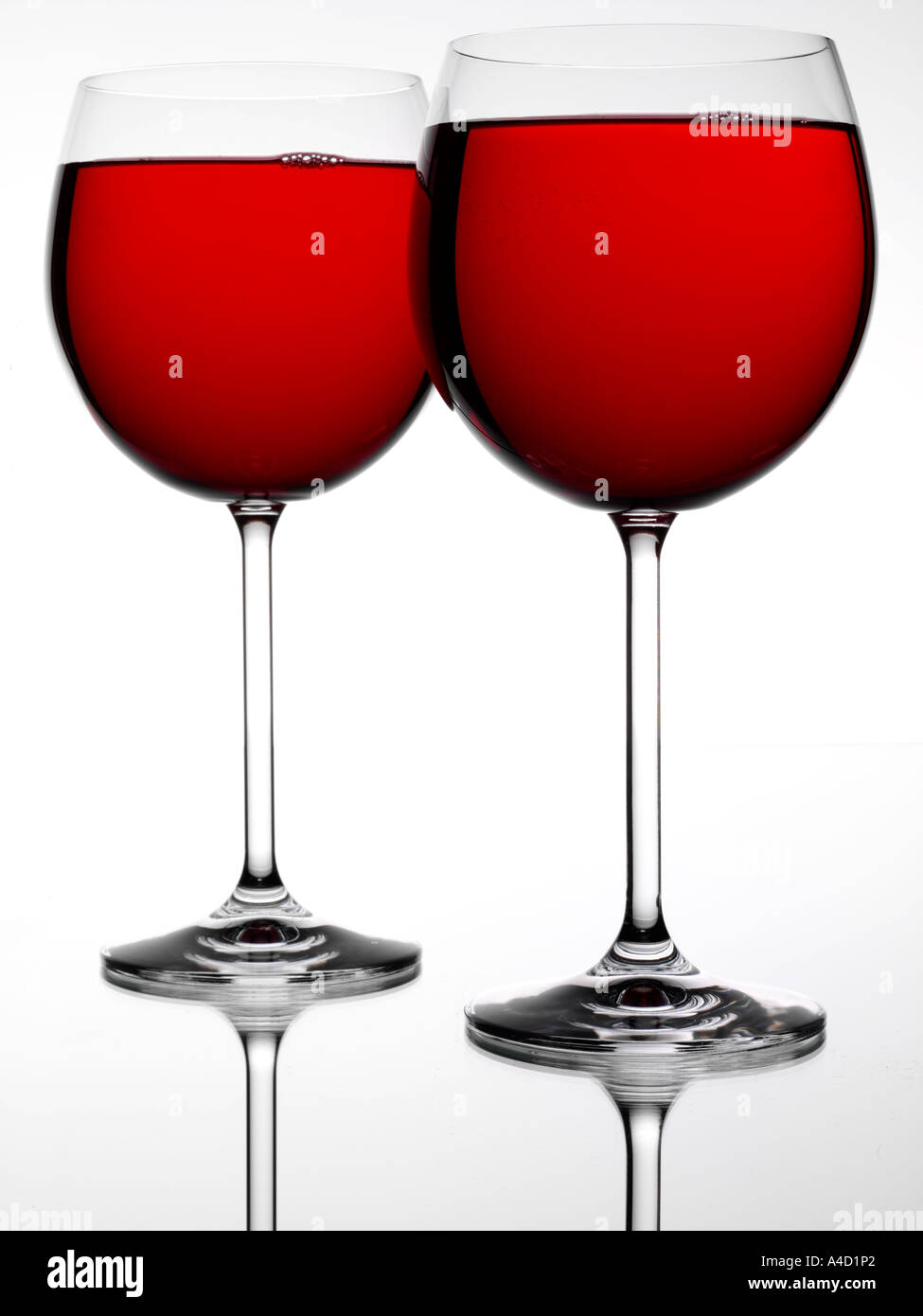 TWO RED WINE GLASSES Stock Photo