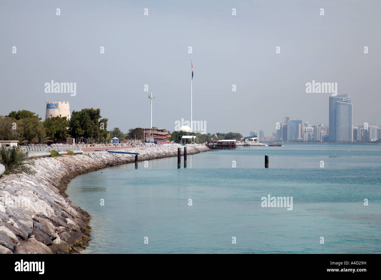 View along the coastline towards flag, Abu Dhabi city, UAE Stock Photo