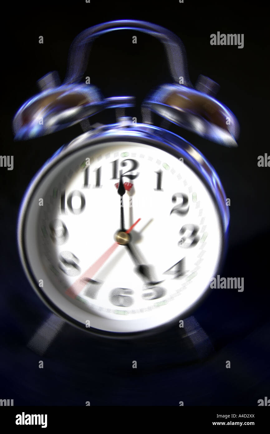 Alarm clock against black background Stock Photo - Alamy