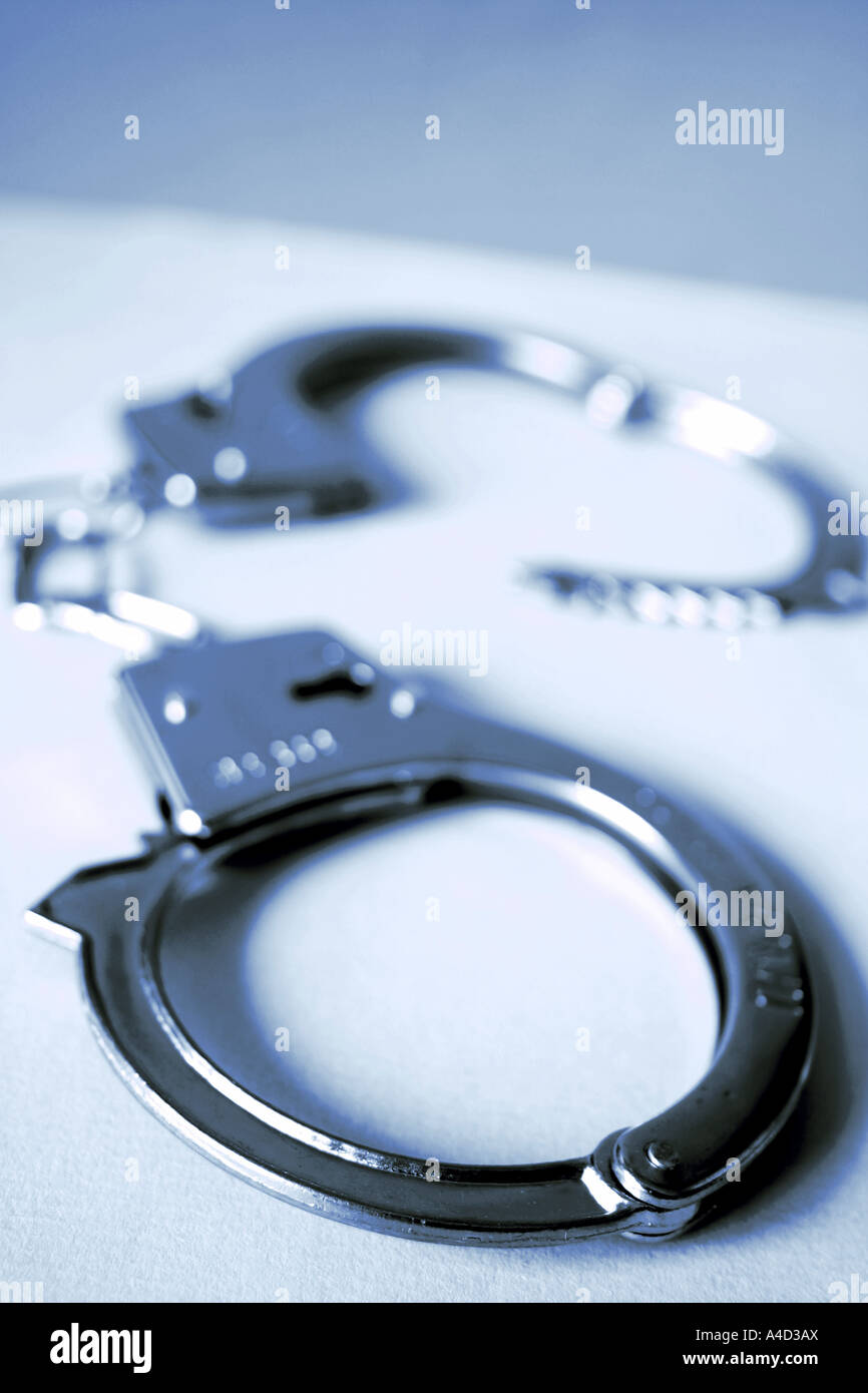 Handcuffs arrest restraint restrain hi-res stock photography and images ...