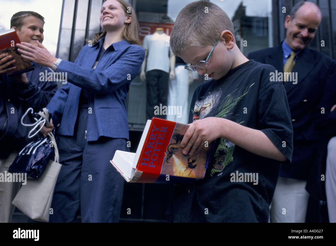 Fans of the Harry Potter books wait to meet author J K Rowling, to sign ...