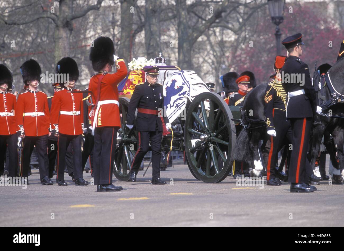 The Grenadier Guards salute at the Queen Mother's funeral,  London 5th April 2002 Stock Photo